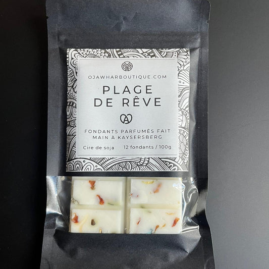Sachet noir contenant 10 carrés de fondant Plage de Réve, parfum coco et orange, décor micra dorée, fait main à Kaysersberg