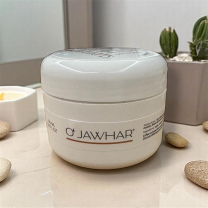 Pot de gommage O’Jawhar sur surface marbrée – soin exfoliant café et argan.