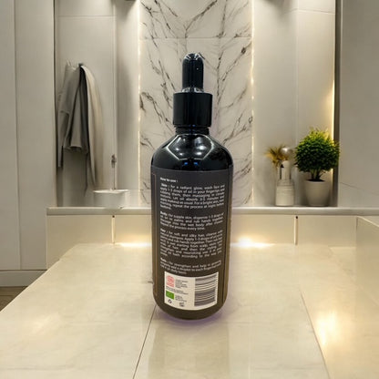 Dos du flacon d’huile d’argan bio avec instructions d’utilisation détaillées.
